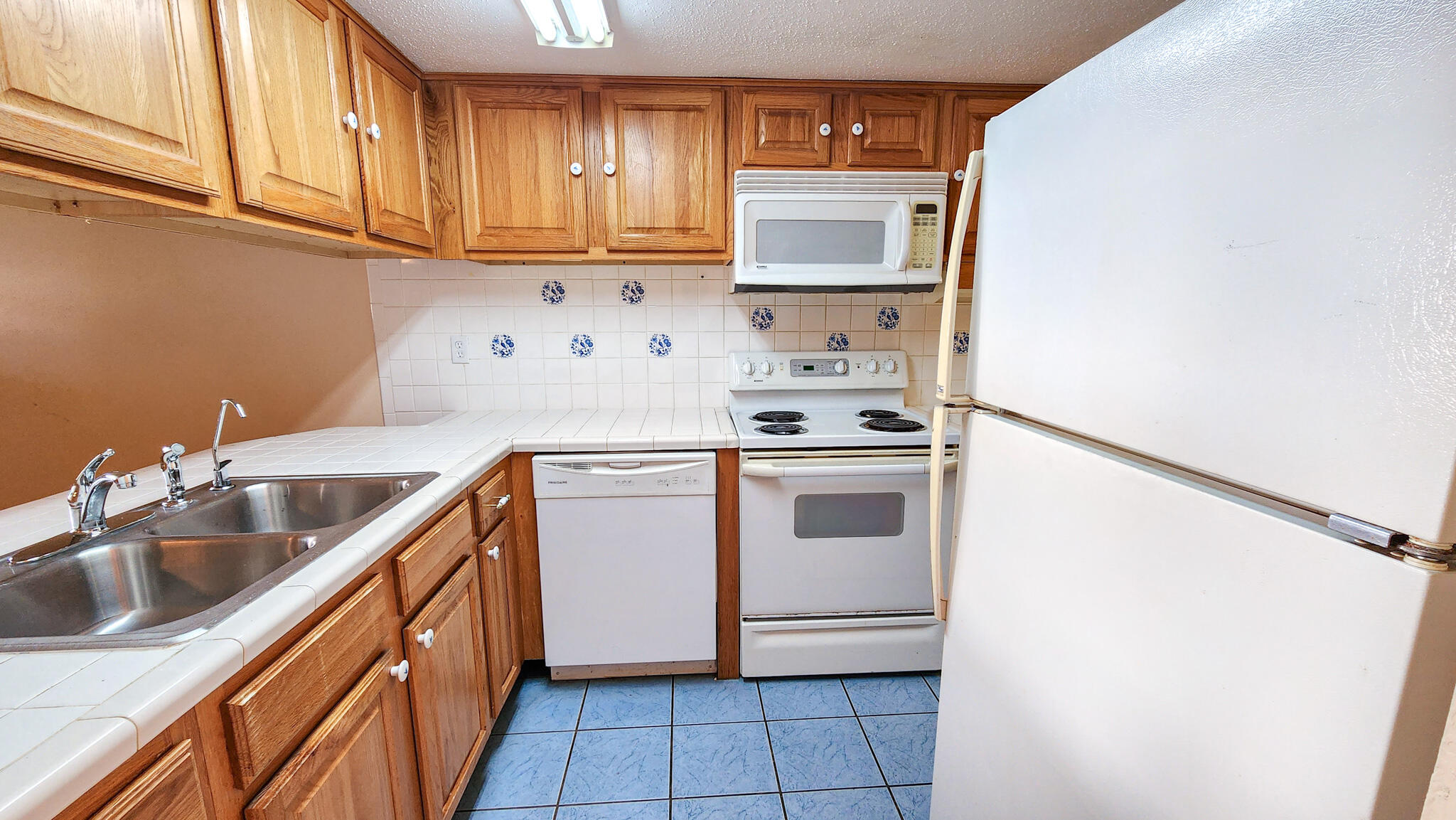 145 4th Avenue, Unit B3 Shalimar, FL 32579 - Photo 8 of 28 a kitchen with stainless steel appliances a sink stove and refrigerator