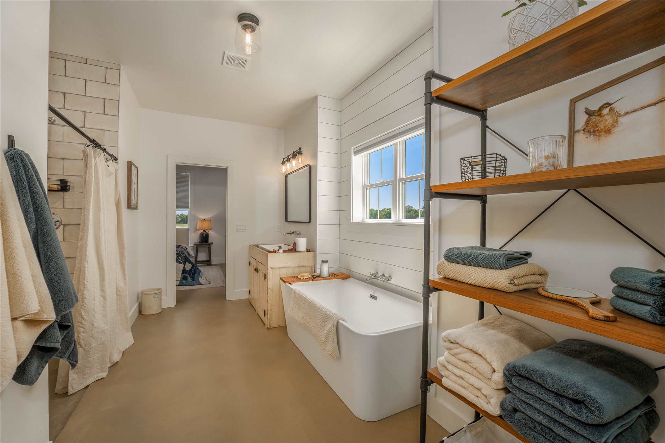 4707 Guenther Road La Grange, TX 78945 - Photo 13 of 26 a bathroom with a sink and a bathtub