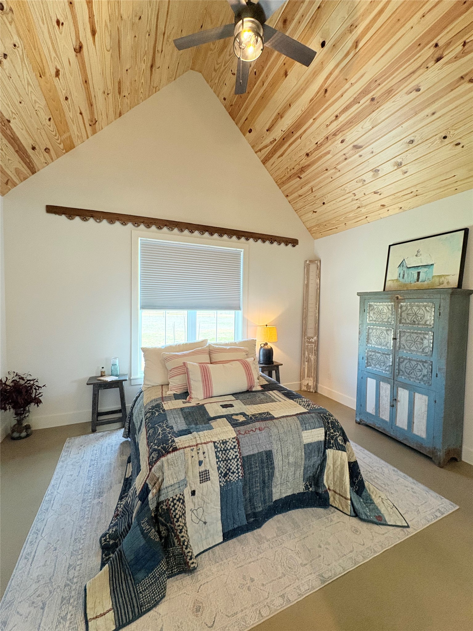 4707 Guenther Road La Grange, TX 78945 - Photo 14 of 26 a bedroom with a bed a table and painting on the wall