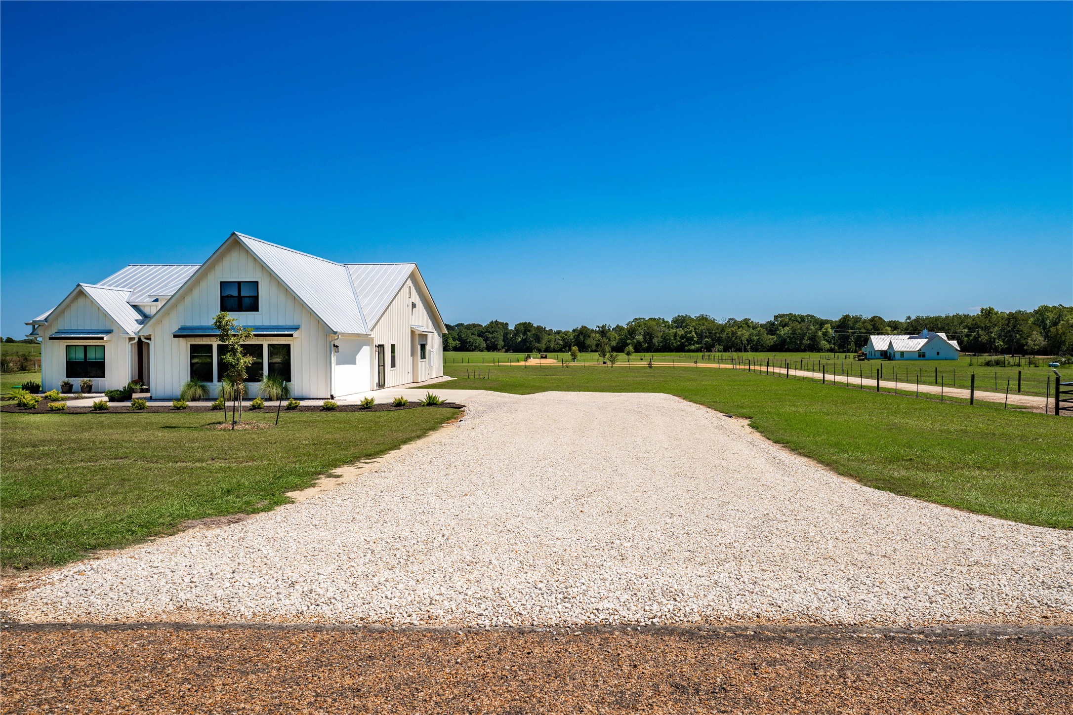 4707 Guenther Road La Grange, TX 78945 - Photo 23 of 26 a view of house with garden and tall trees