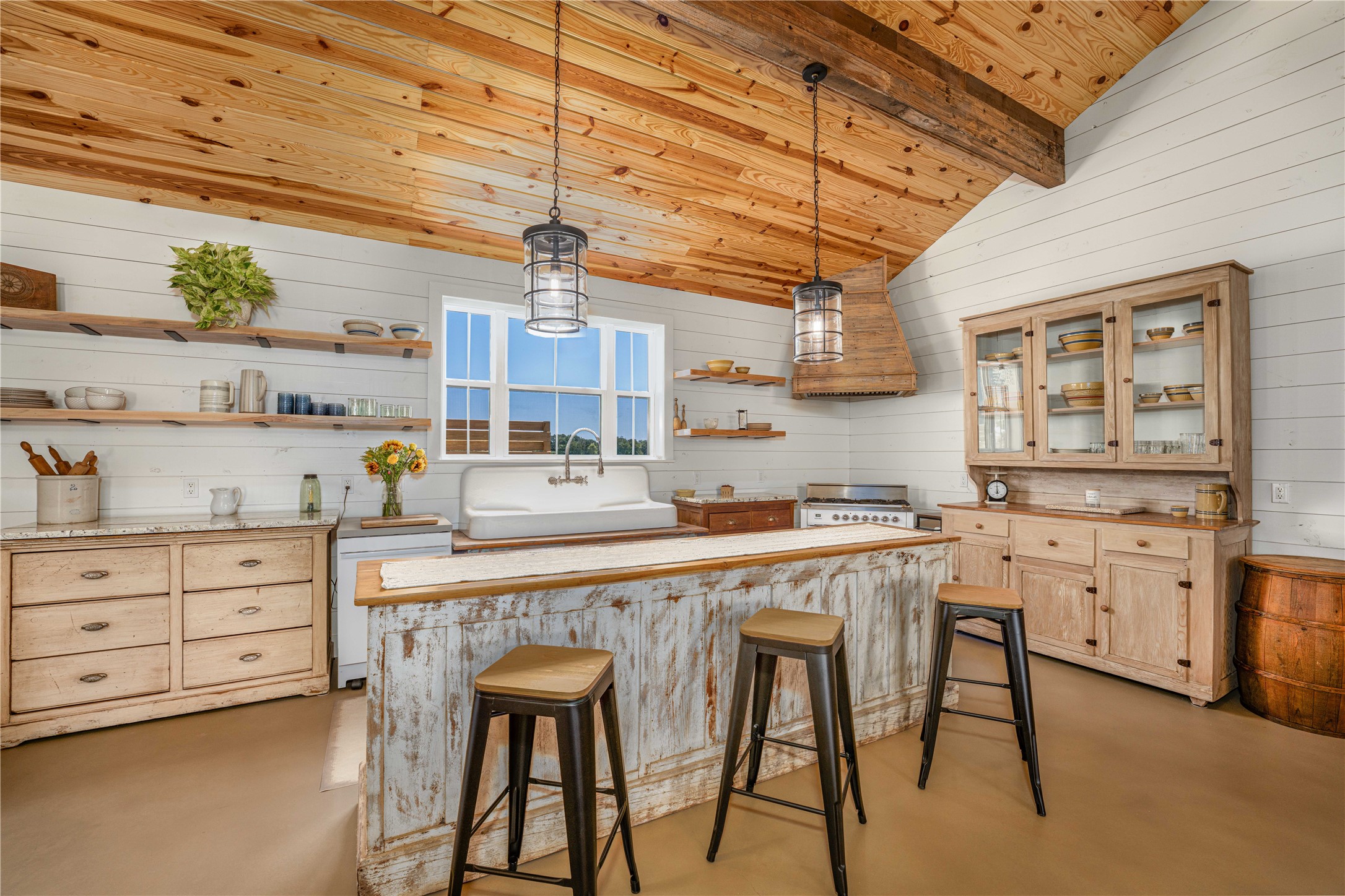 4707 Guenther Road La Grange, TX 78945 - Photo 8 of 26 a kitchen with cabinets and chairs