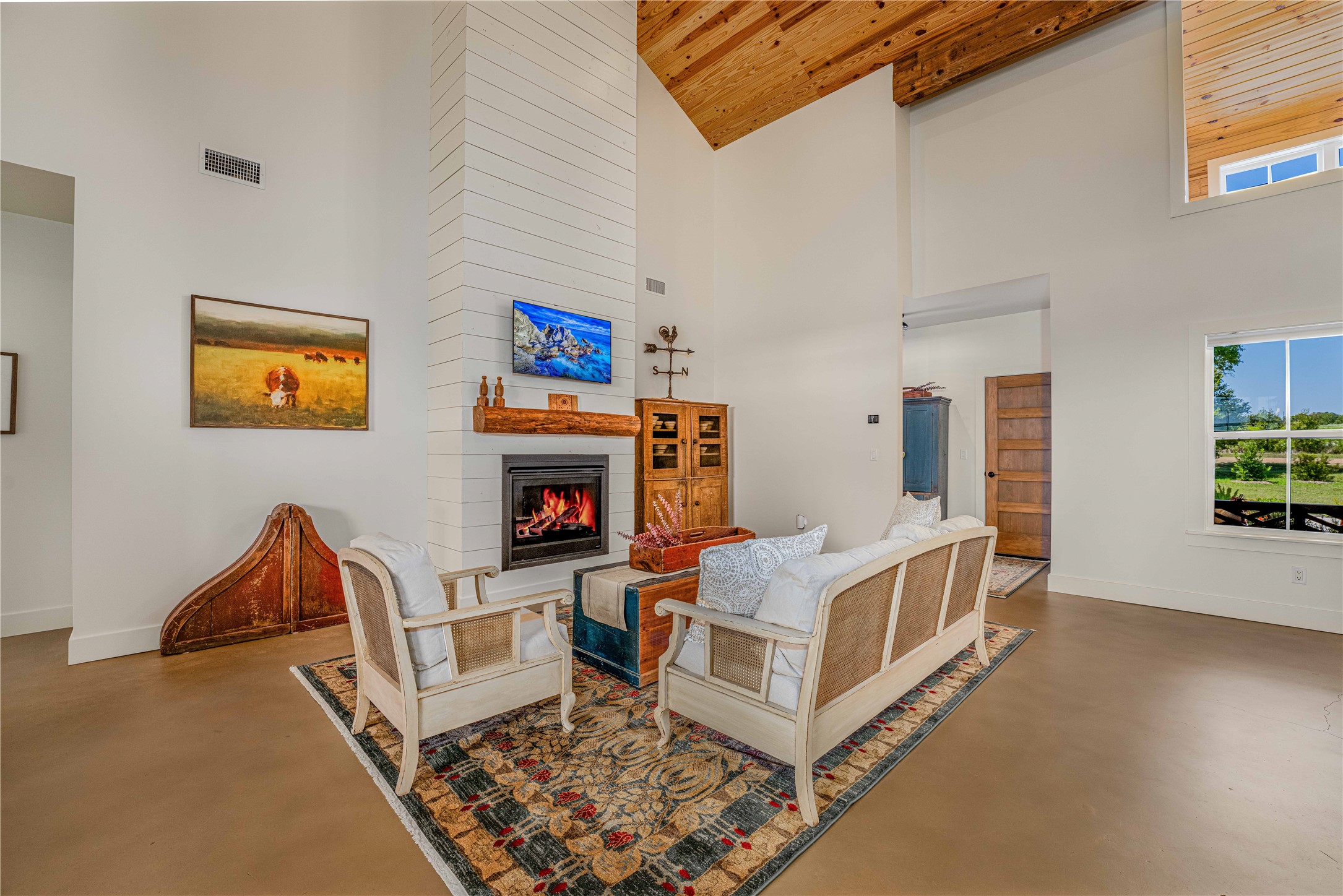 4707 Guenther Road La Grange, TX 78945 - Photo 9 of 26 a bed room with furniture and a fireplace