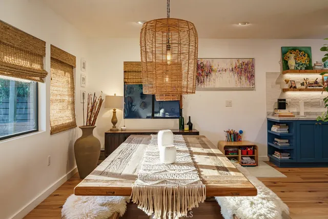 a kitchen with stainless steel appliances granite countertop a refrigerator a stove a sink and a microwave