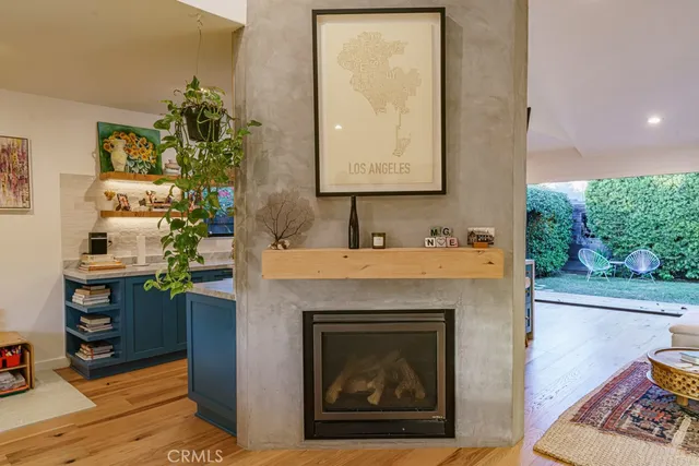 a kitchen with stainless steel appliances a sink stove and a large window