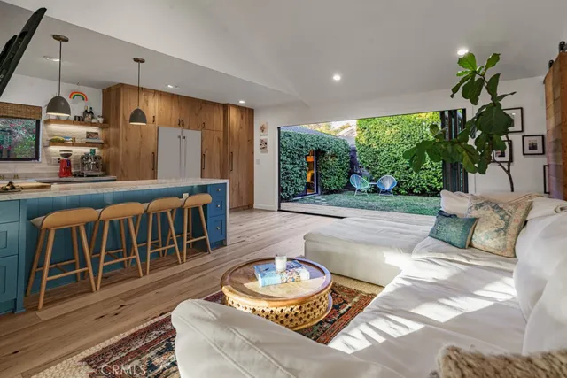 a bedroom with bed and a baby crib