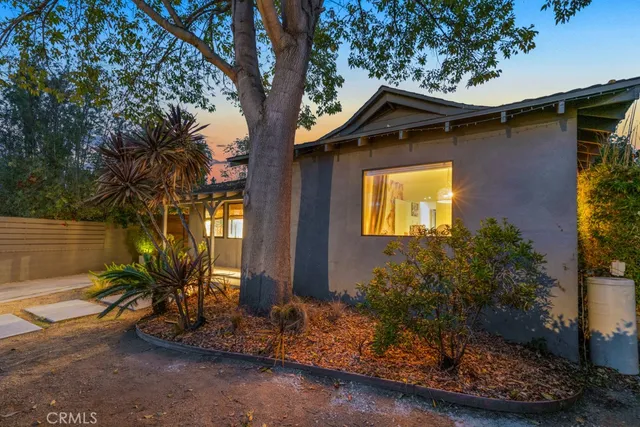 a view of a house with a small yard