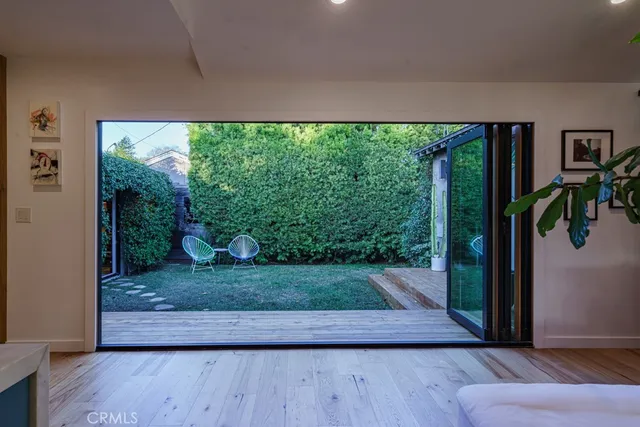 a bathroom with a granite countertop toilet sink and mirror