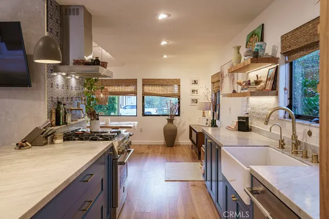 a bedroom with a bed and a large window with balcony view