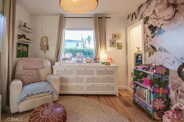 a view of a patio with table and chairs potted plants