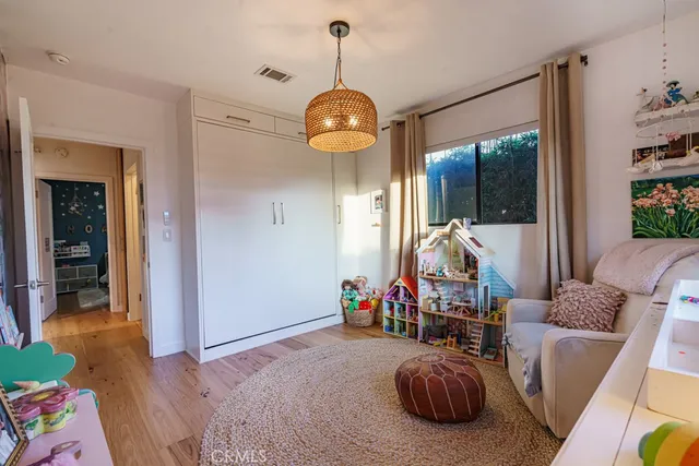 a view of backyard with barbeque grill and outdoor seating