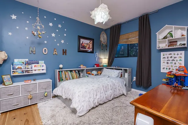 a view of a chair and tables in the backyard of the house