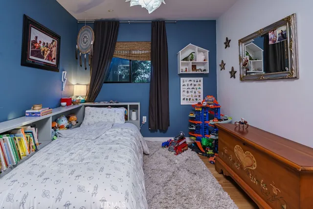 a view of a chair and table in backyard of the house