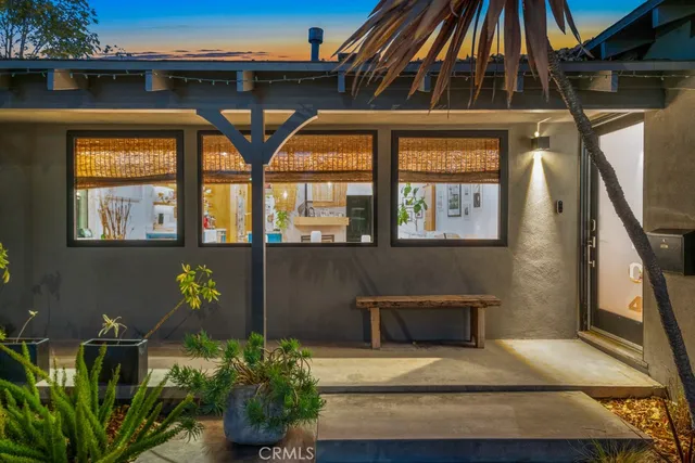 a front view of a house with outdoor space