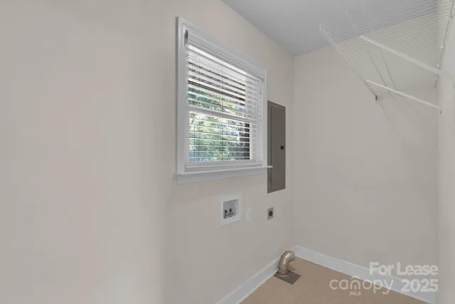 a bathroom with a window and a shower