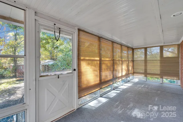 a view of an empty room with a large window