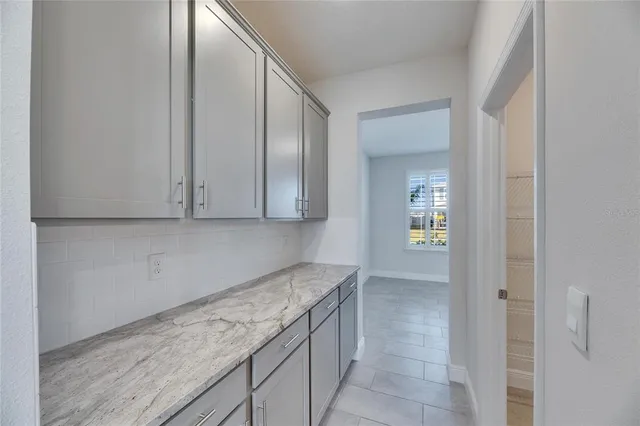 a bathroom with a sink and mirror