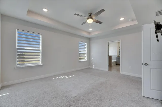 a kitchen with a refrigerator and a stove top oven