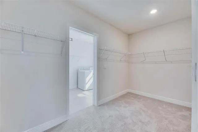 a utility room with a sink dryer and washer