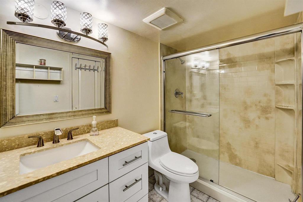100 Golden Isles Drive, Unit 815 Hallandale Beach, FL 33009 - Photo 16 of 42 a bathroom with a sink and a mirror