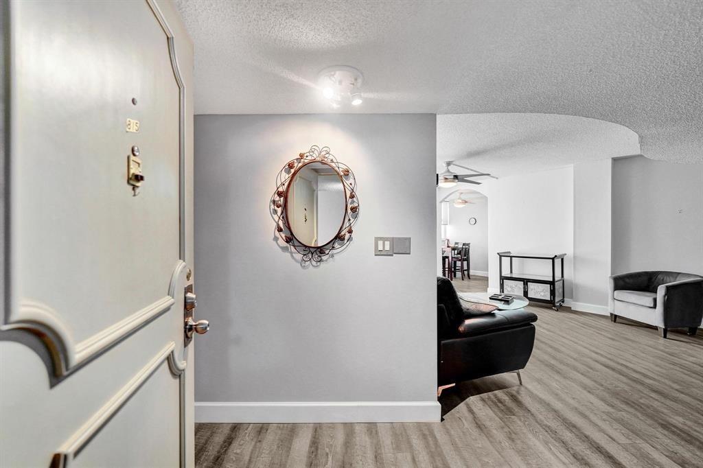 100 Golden Isles Drive, Unit 815 Hallandale Beach, FL 33009 - Photo 2 of 42 a living room with furniture