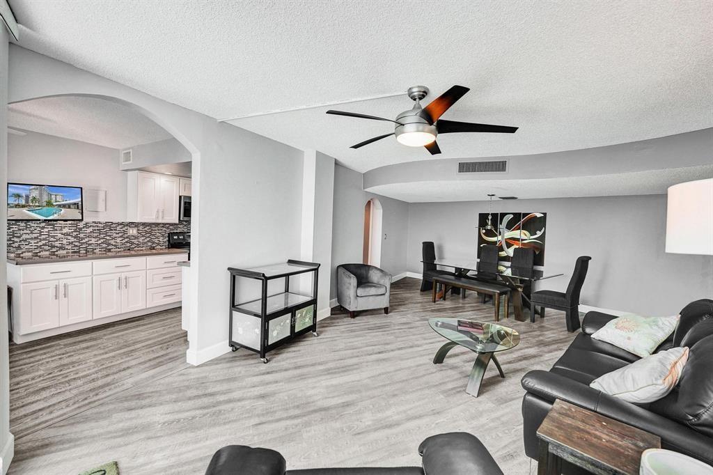 100 Golden Isles Drive, Unit 815 Hallandale Beach, FL 33009 - Photo 24 of 42 a living room with furniture and kitchen view