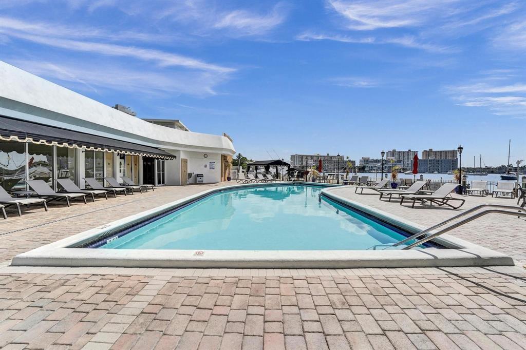 100 Golden Isles Drive, Unit 815 Hallandale Beach, FL 33009 - Photo 39 of 42 a house view with a swimming pool