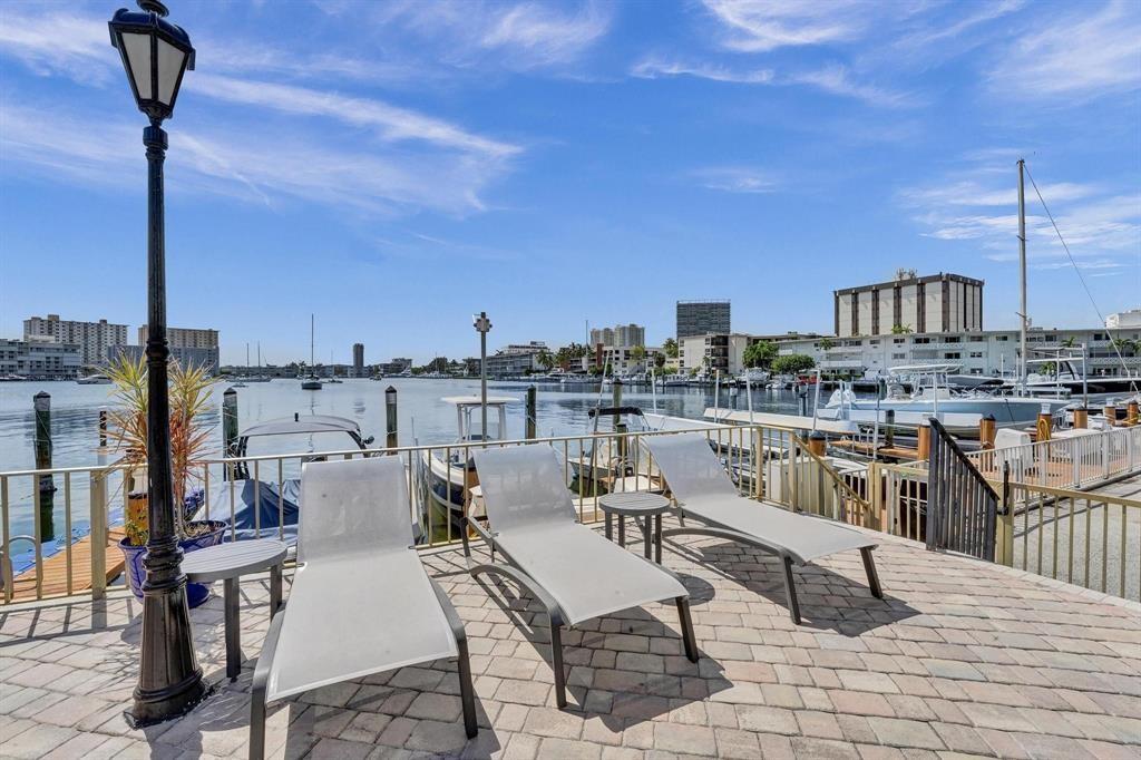 100 Golden Isles Drive, Unit 815 Hallandale Beach, FL 33009 - Photo 40 of 42 a view of a terrace with seating area