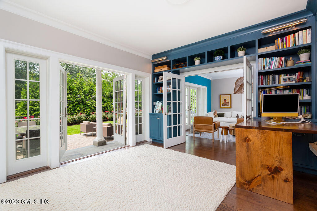 552 River Road Cos Cob, CT 06807 - Photo 12 of 35 a living room with fireplace furniture and a flat screen tv