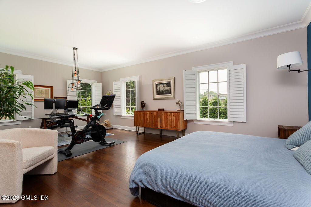 552 River Road Cos Cob, CT 06807 - Photo 14 of 35 a bed room with two beds and potted plant