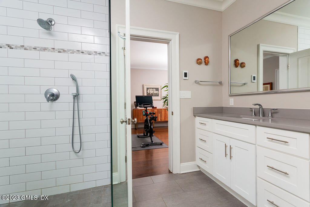 552 River Road Cos Cob, CT 06807 - Photo 15 of 35 a bathroom with a granite countertop shower sink and mirror