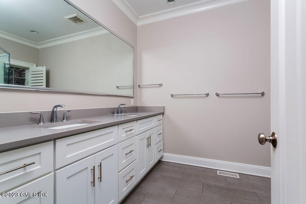 552 River Road Cos Cob, CT 06807 - Photo 24 of 35 a bathroom with a granite countertop sink and mirror