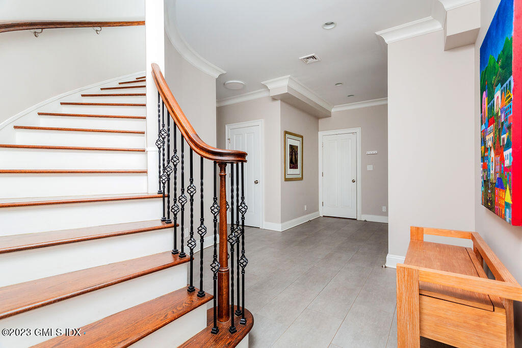 552 River Road Cos Cob, CT 06807 - Photo 25 of 35 a view of entryway with stairs and furniture