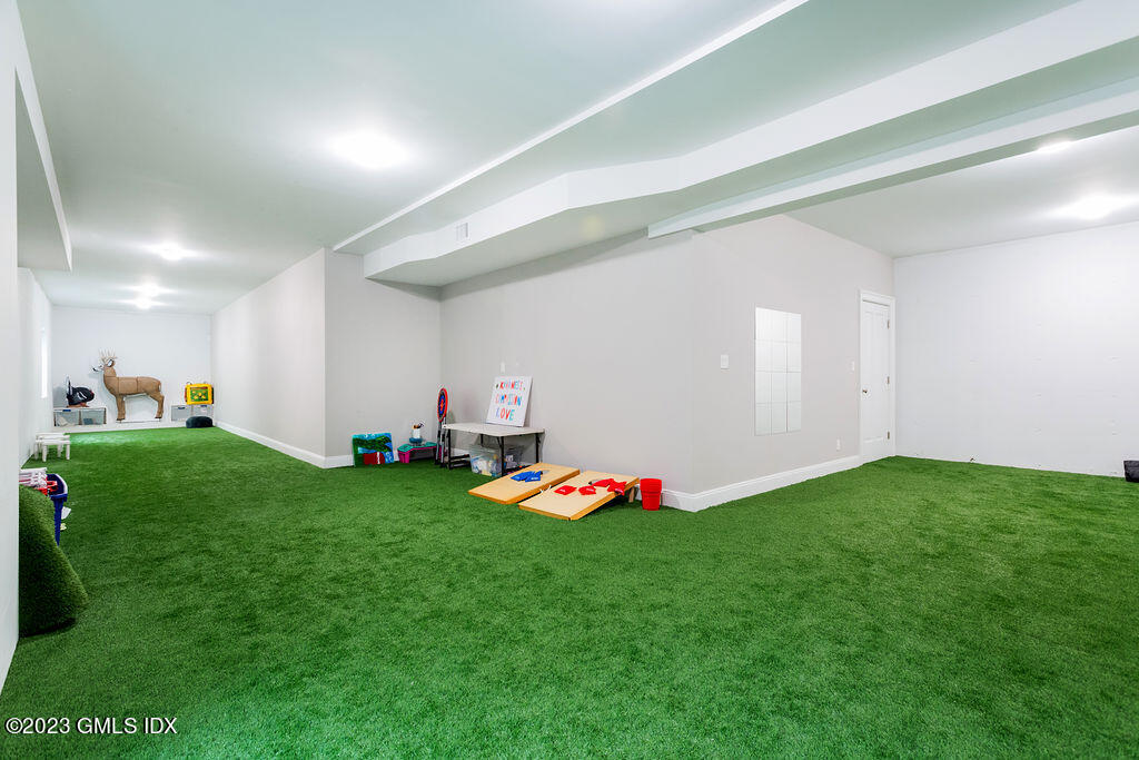552 River Road Cos Cob, CT 06807 - Photo 26 of 35 a view of a room with toys and wooden floor