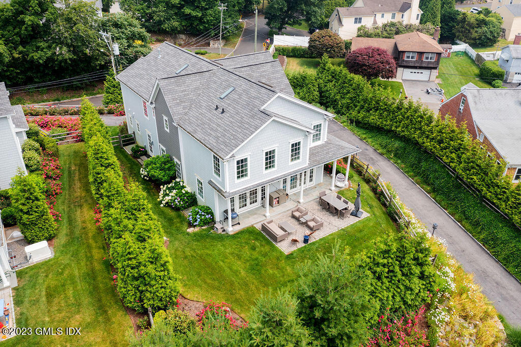 552 River Road Cos Cob, CT 06807 - Photo 29 of 35 an aerial view of a house with garden space sitting space and swimming pool