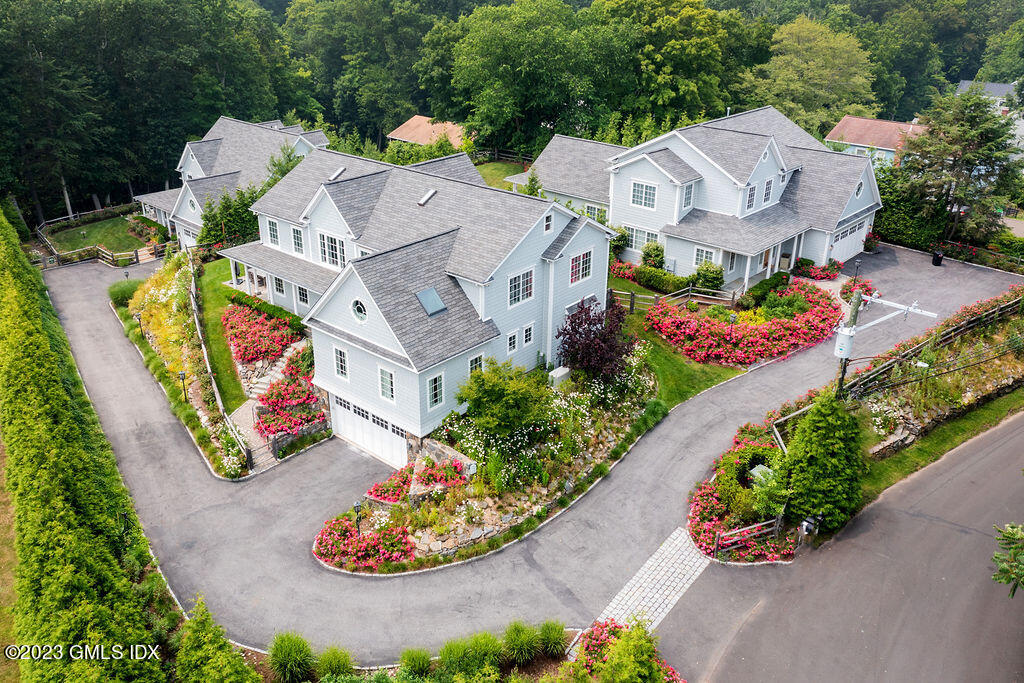 552 River Road Cos Cob, CT 06807 - Photo 30 of 35 an aerial view of a house with a yard and garden