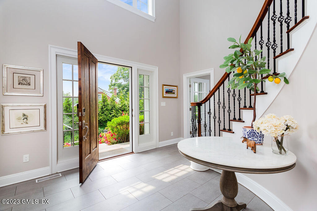 552 River Road Cos Cob, CT 06807 - Photo 4 of 35 a view of a livingroom with furniture swimming pool and wooden floor