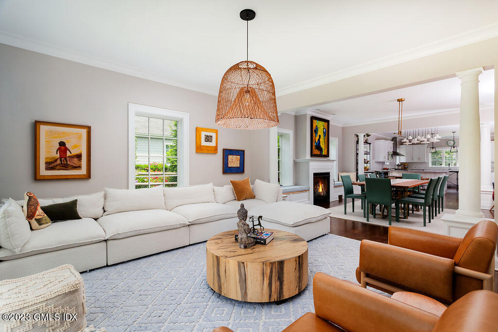 552 River Road Cos Cob, CT 06807 - Photo 5 of 35 a living room with furniture a large window and a chandelier