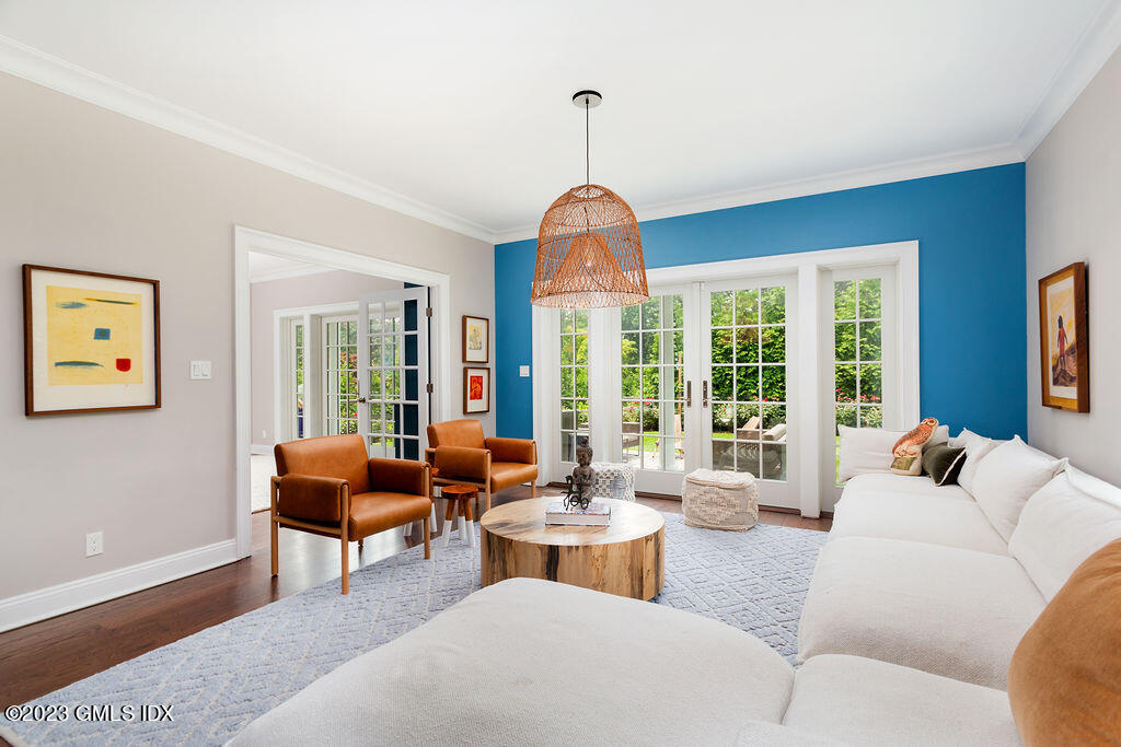 552 River Road Cos Cob, CT 06807 - Photo 6 of 35 a living room with furniture a table and a large window