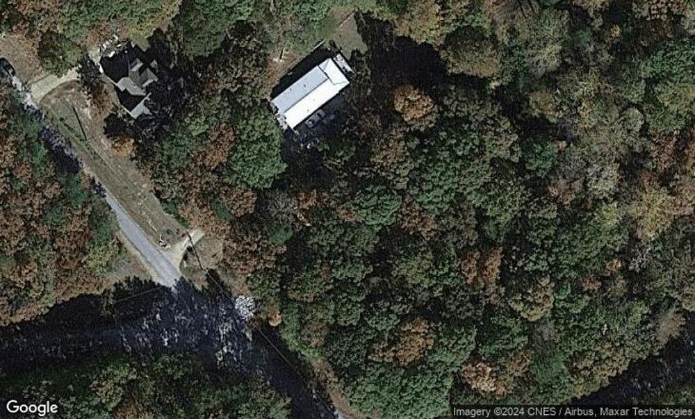 a view of a house in a forest