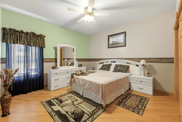 a bedroom with a bed and a dresser