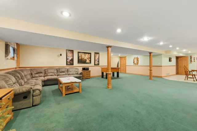 a living room with furniture and a table