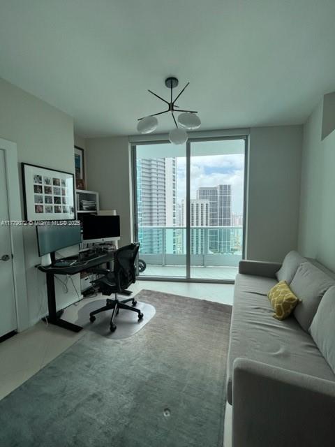 900 Biscayne Boulevard, Unit 4312 Miami, FL 33132 - Photo 14 of 36 a work room with furniture and a large window
