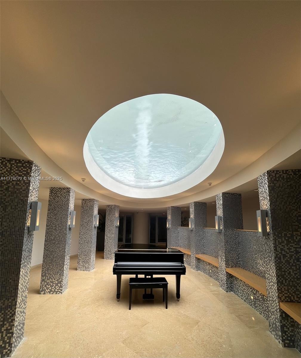 900 Biscayne Boulevard, Unit 4312 Miami, FL 33132 - Photo 26 of 36 a living room with furniture and a potted plant