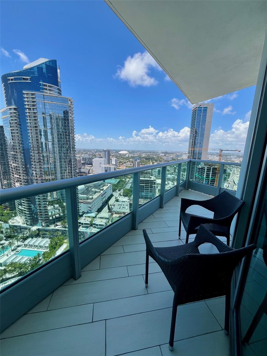 900 Biscayne Boulevard, Unit 4312 Miami, FL 33132 - Photo 36 of 36 a view of a chairs and table in patio