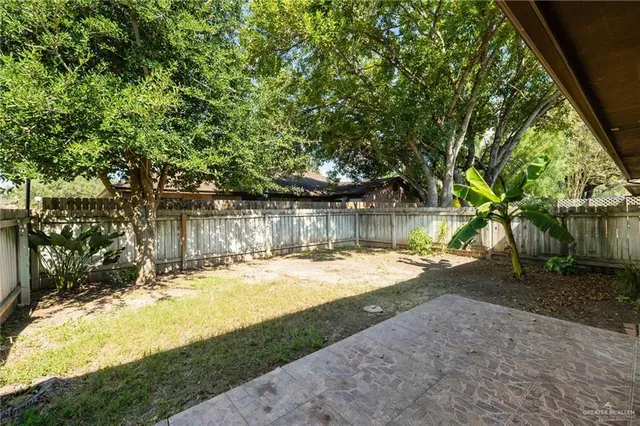 a view of a yard with swimming pool