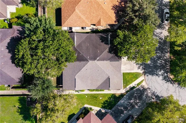 an aerial view of a house with a yard