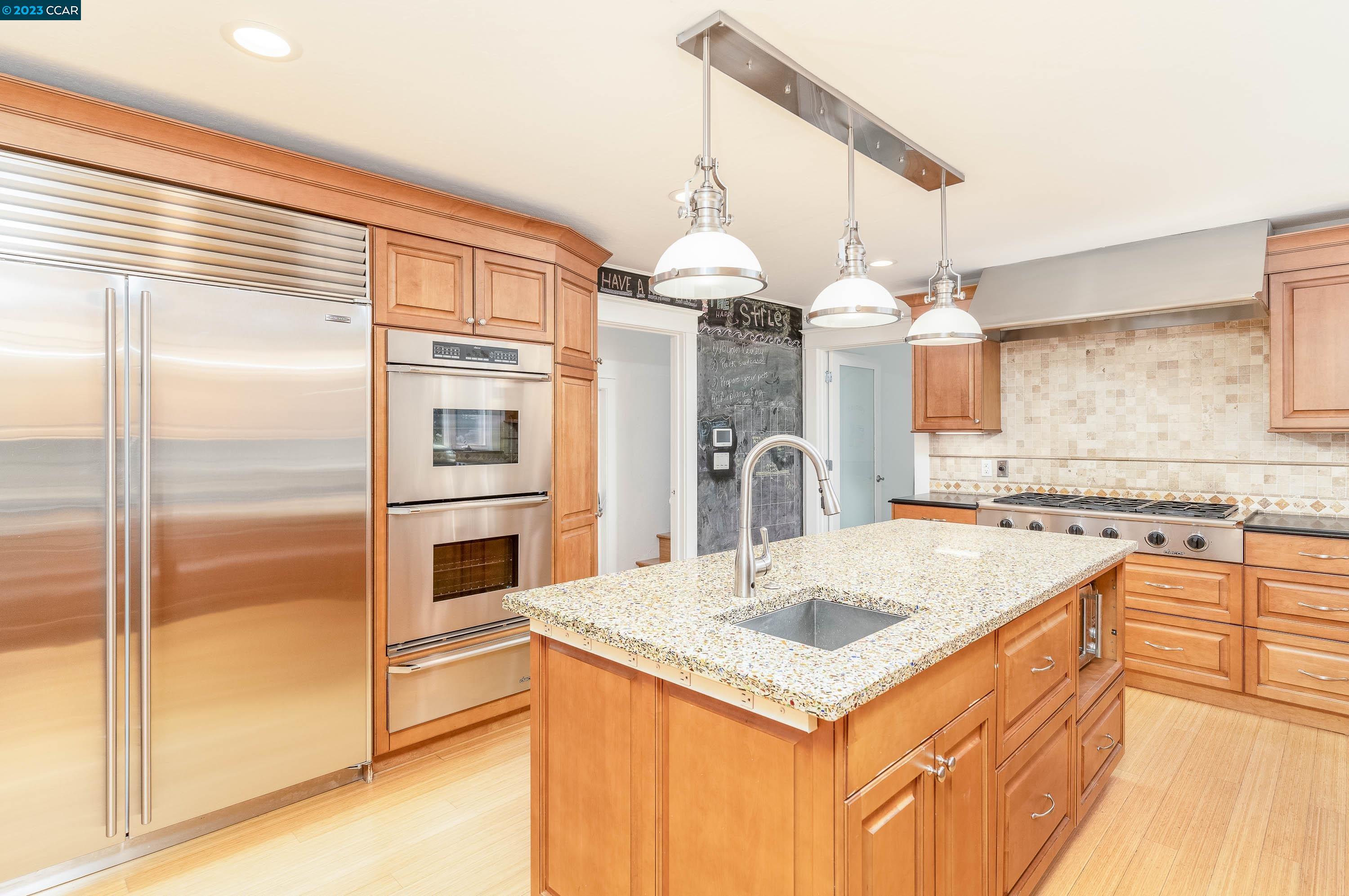 1206 Rimer Drive Moraga, CA 94556 - Photo 12 of 53 a kitchen with a refrigerator a stove and a sink