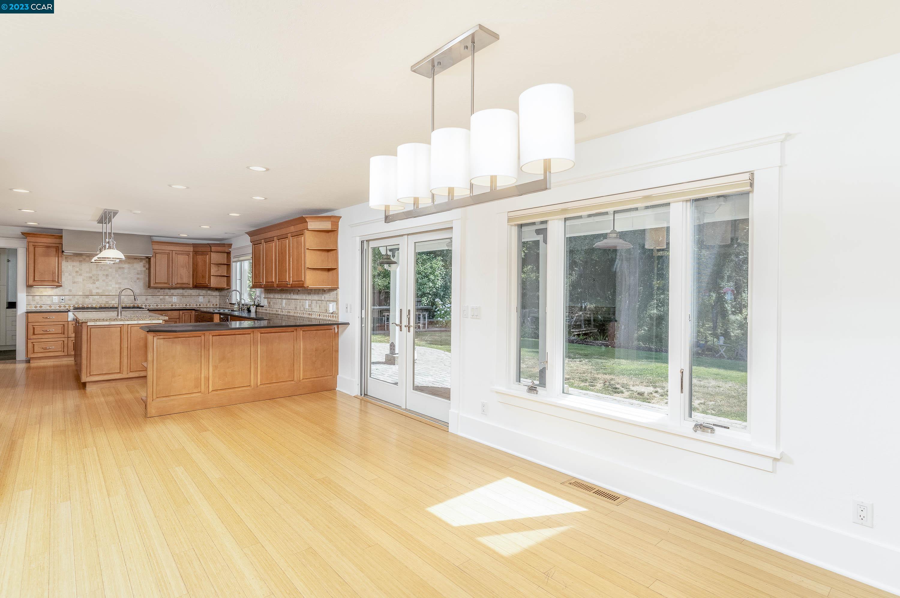 1206 Rimer Drive Moraga, CA 94556 - Photo 13 of 53 a view of a kitchen with kitchen island a sink and a view of living room