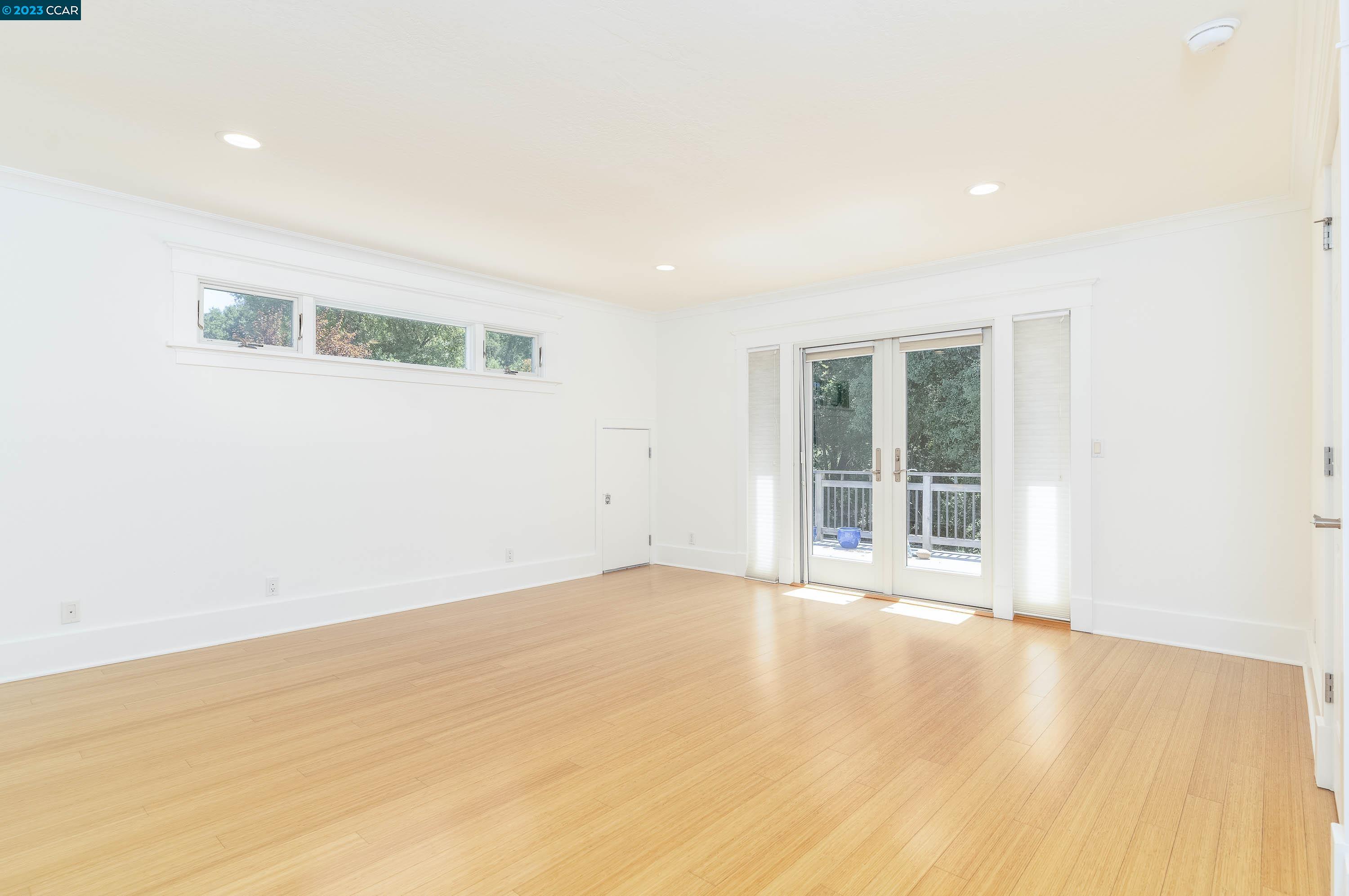 1206 Rimer Drive Moraga, CA 94556 - Photo 19 of 53 a view of an empty room with wooden floor and a window