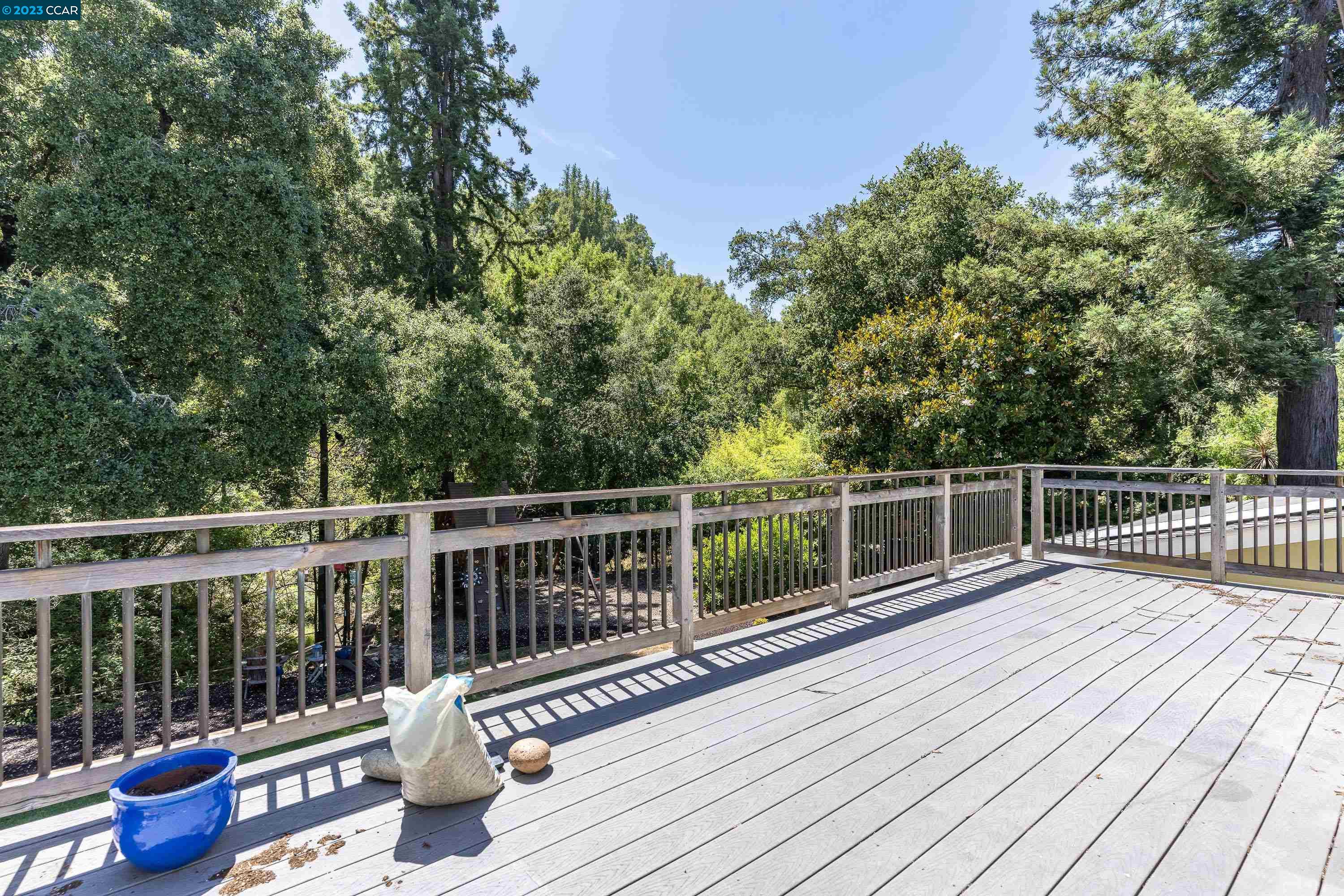 1206 Rimer Drive Moraga, CA 94556 - Photo 20 of 53 a view of a deck with two chair and wooden floor